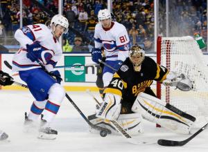 Boston Bruins' Tuukka Rask (40) clears the puck beside Montreal Canadiens' Paul Byron (41) during the third period of the NHL Winter Classic hockey game at Gillette Stadium in Foxborough, Mass., Friday, Jan. 1, 2016. The Canadiens won 5-1. (AP Photo/Michael Dwyer)